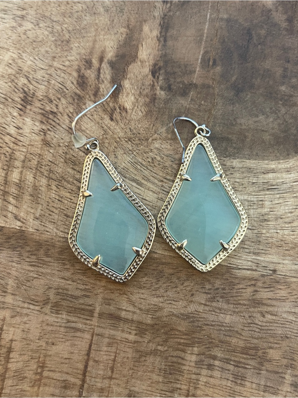Kendra Scott earrings in gold and chalcedony